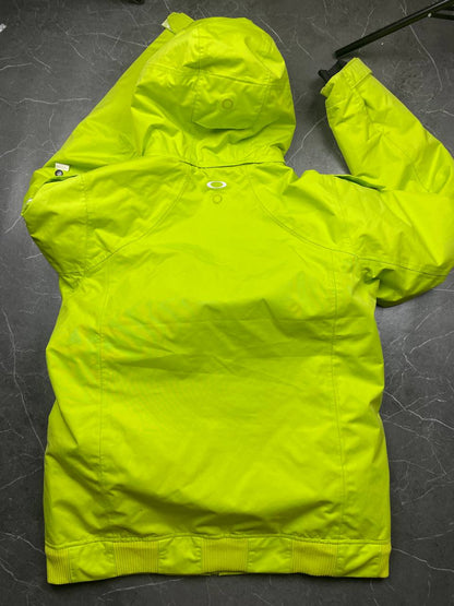 Oakley lime green ski jacket with hood, multicolored interior lining, logo on chest.