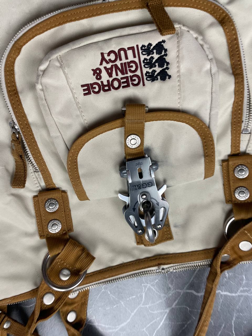 George Gina & Lucy beige canvas shoulder bag with brown straps and embroidered logo.