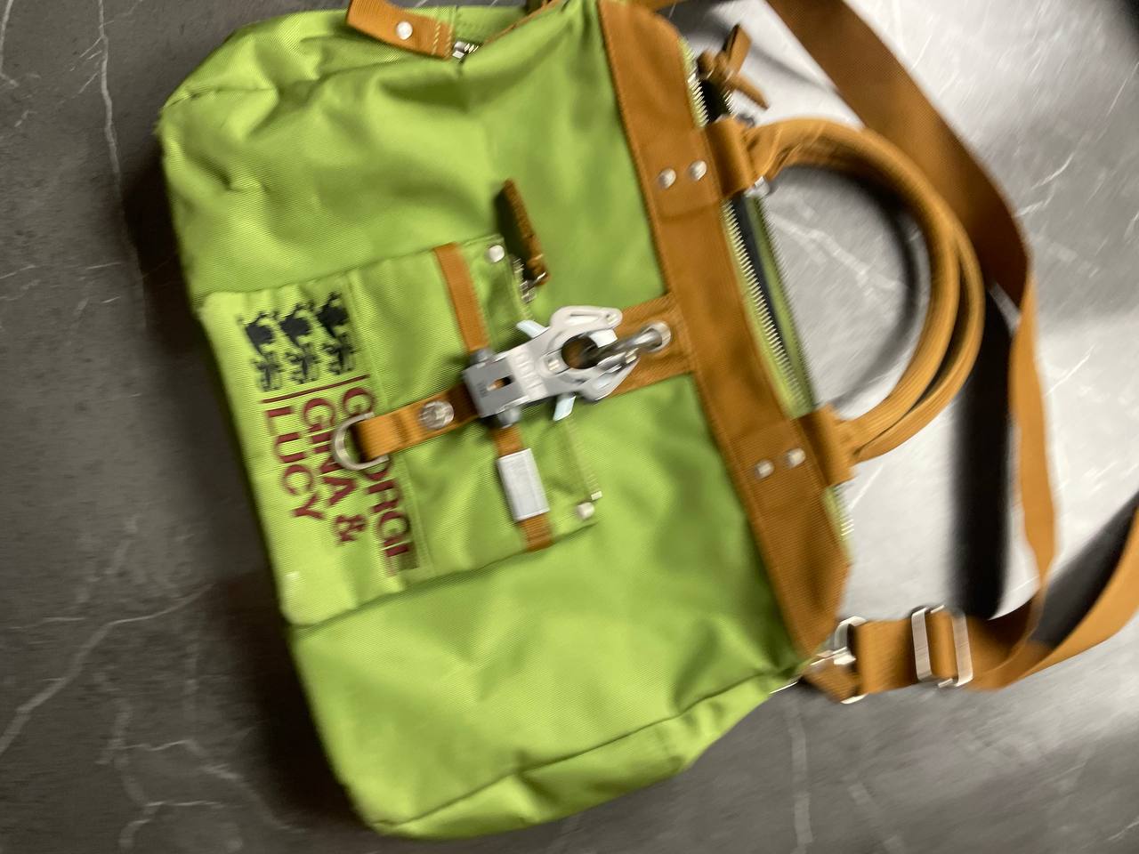 George Gina & Lucy brown and green shoulder bag with embroidered logo and metal clasp.