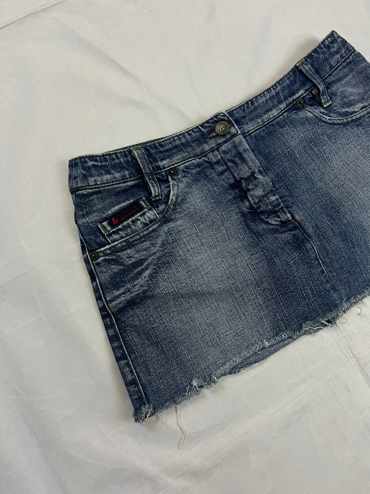 & Other Stories blue denim mini skirt with frayed hem and branded button fly closure