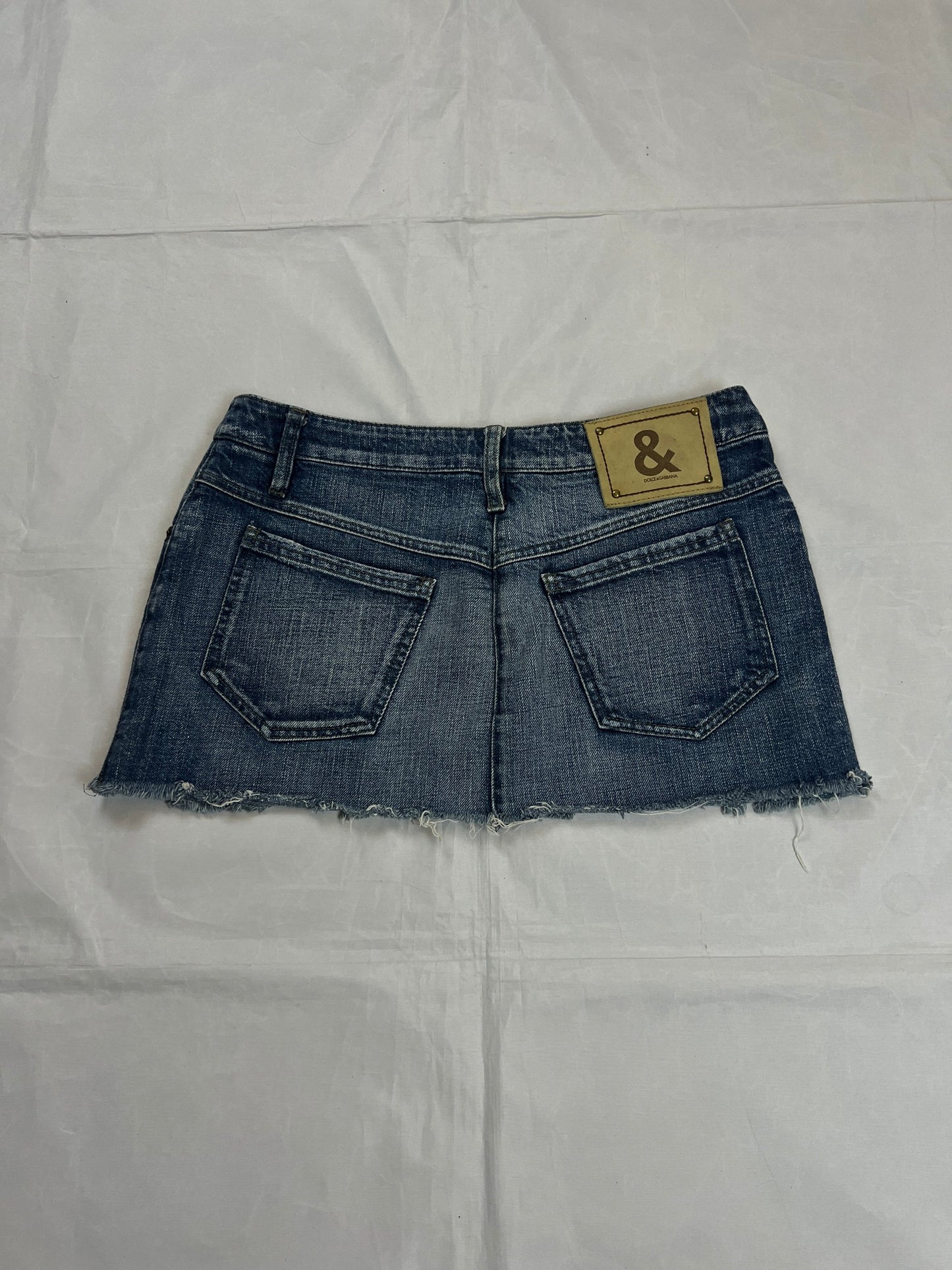 & Other Stories blue denim mini skirt with frayed hem and branded button fly closure