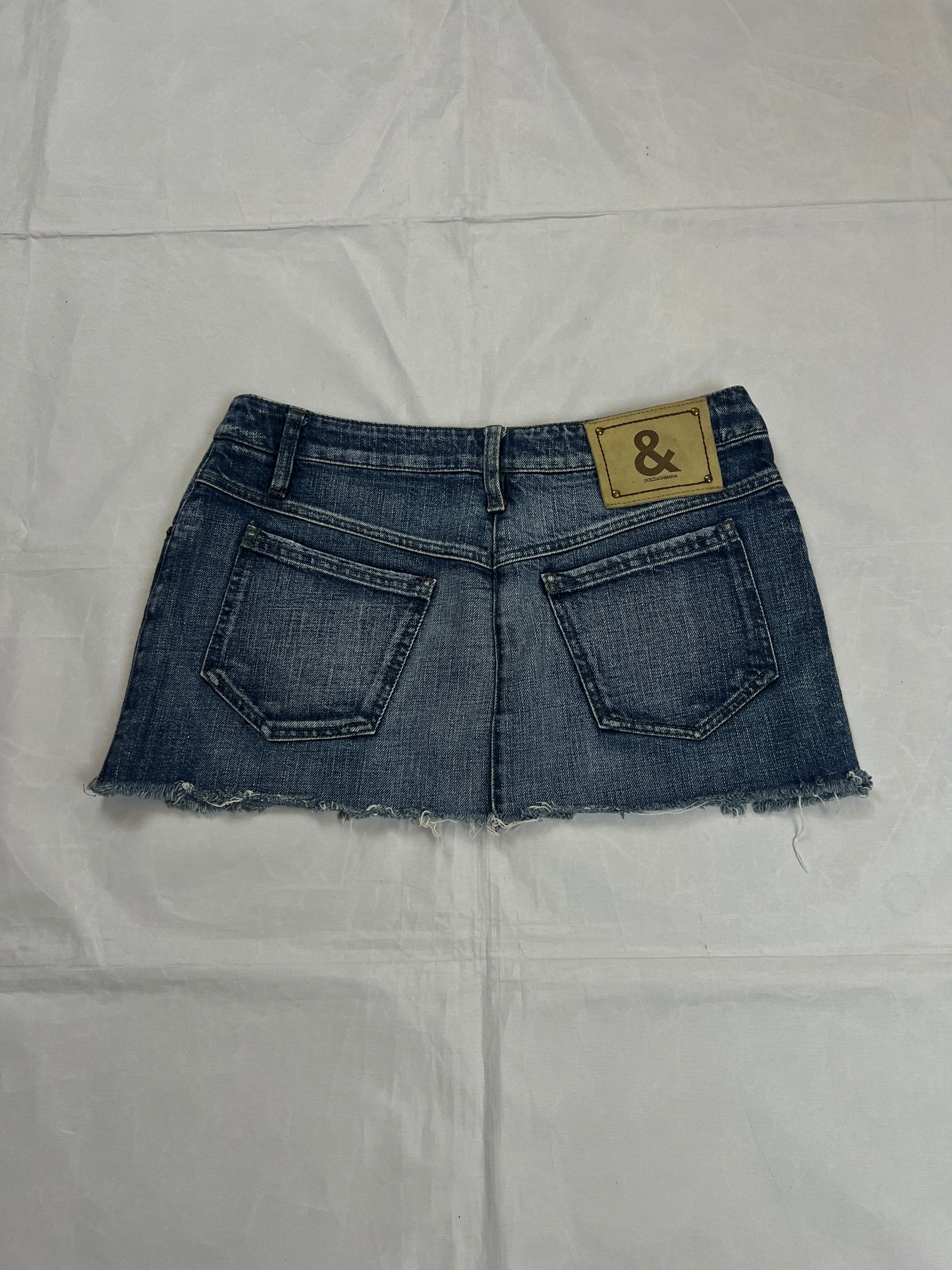 & Other Stories blue denim mini skirt with frayed hem and branded button fly closure