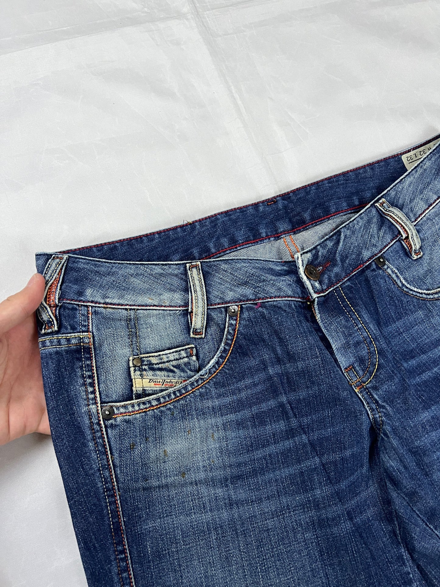 Diesel blue denim jeans W32 L32 with distressed wash and embroidered back pockets.