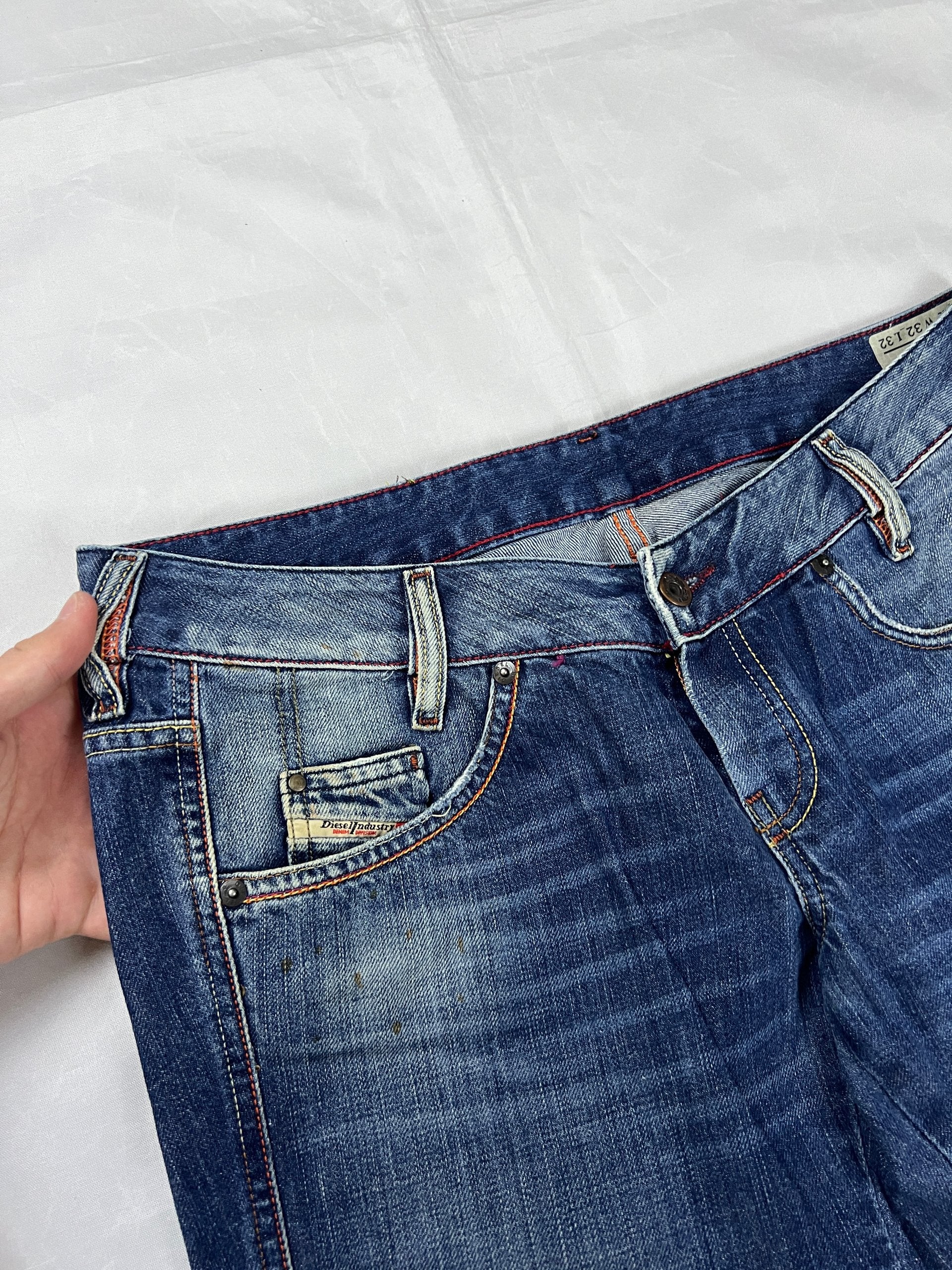 Diesel blue denim jeans W32 L32 with distressed wash and embroidered back pockets.