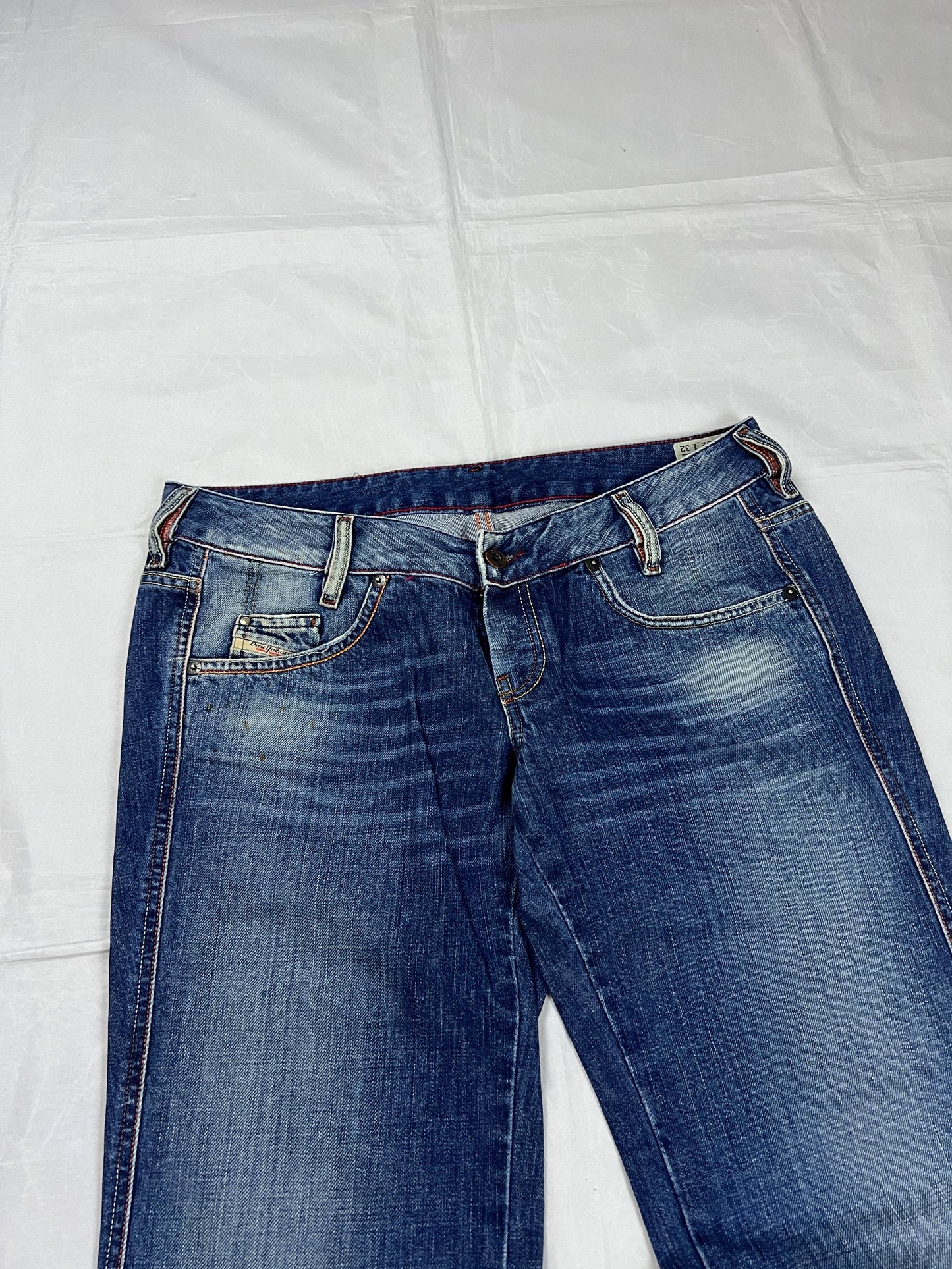 Diesel blue denim jeans W32 L32 with distressed wash and embroidered back pockets.