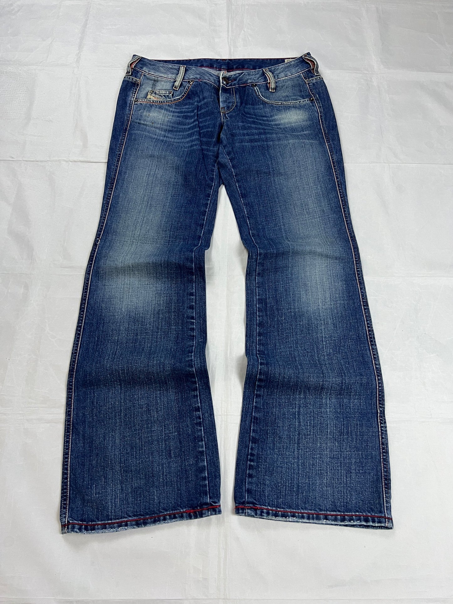 Diesel blue denim jeans W32 L32 with distressed wash and embroidered back pockets.