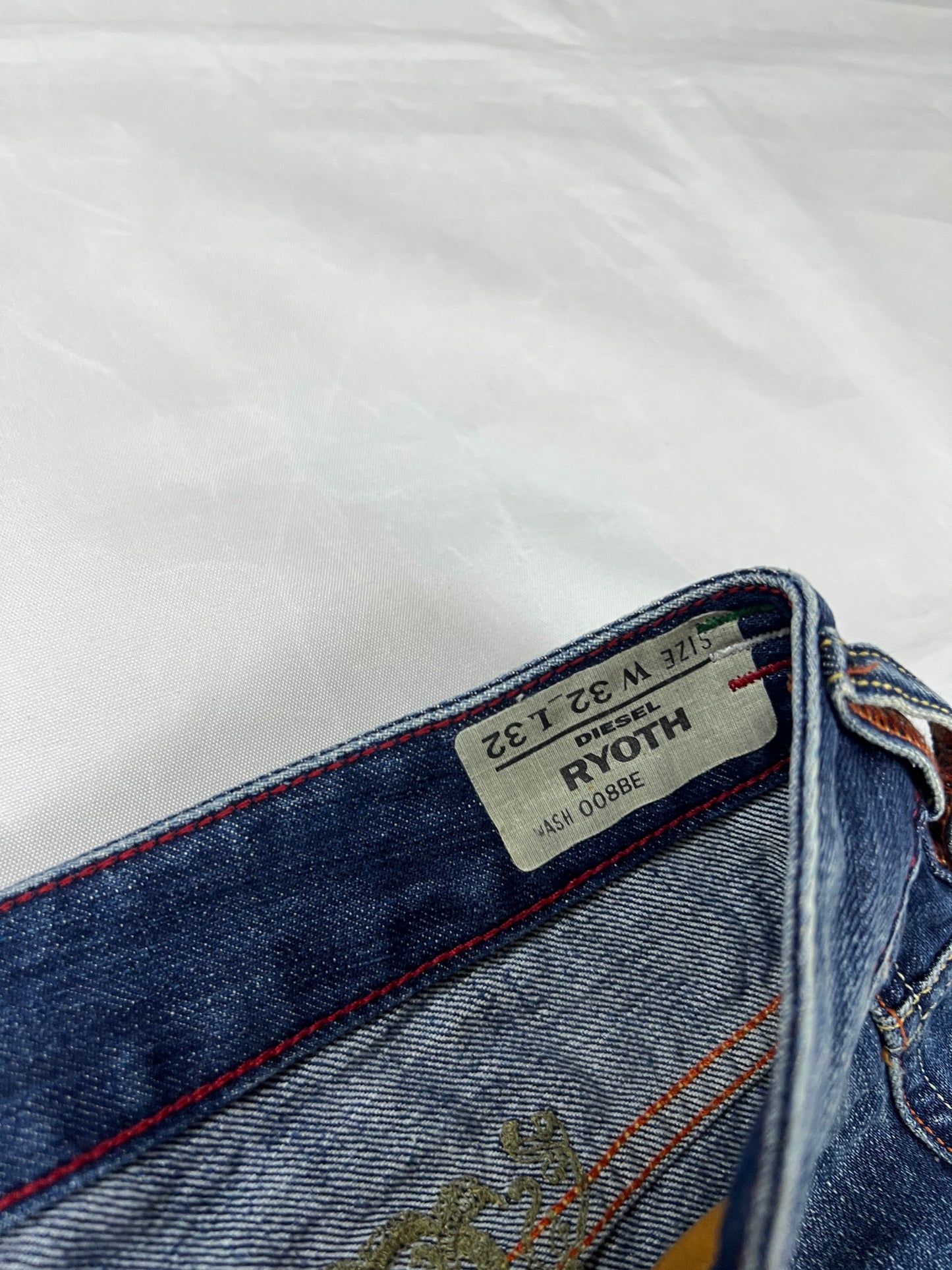 Diesel blue denim jeans W32 L32 with distressed wash and embroidered back pockets.