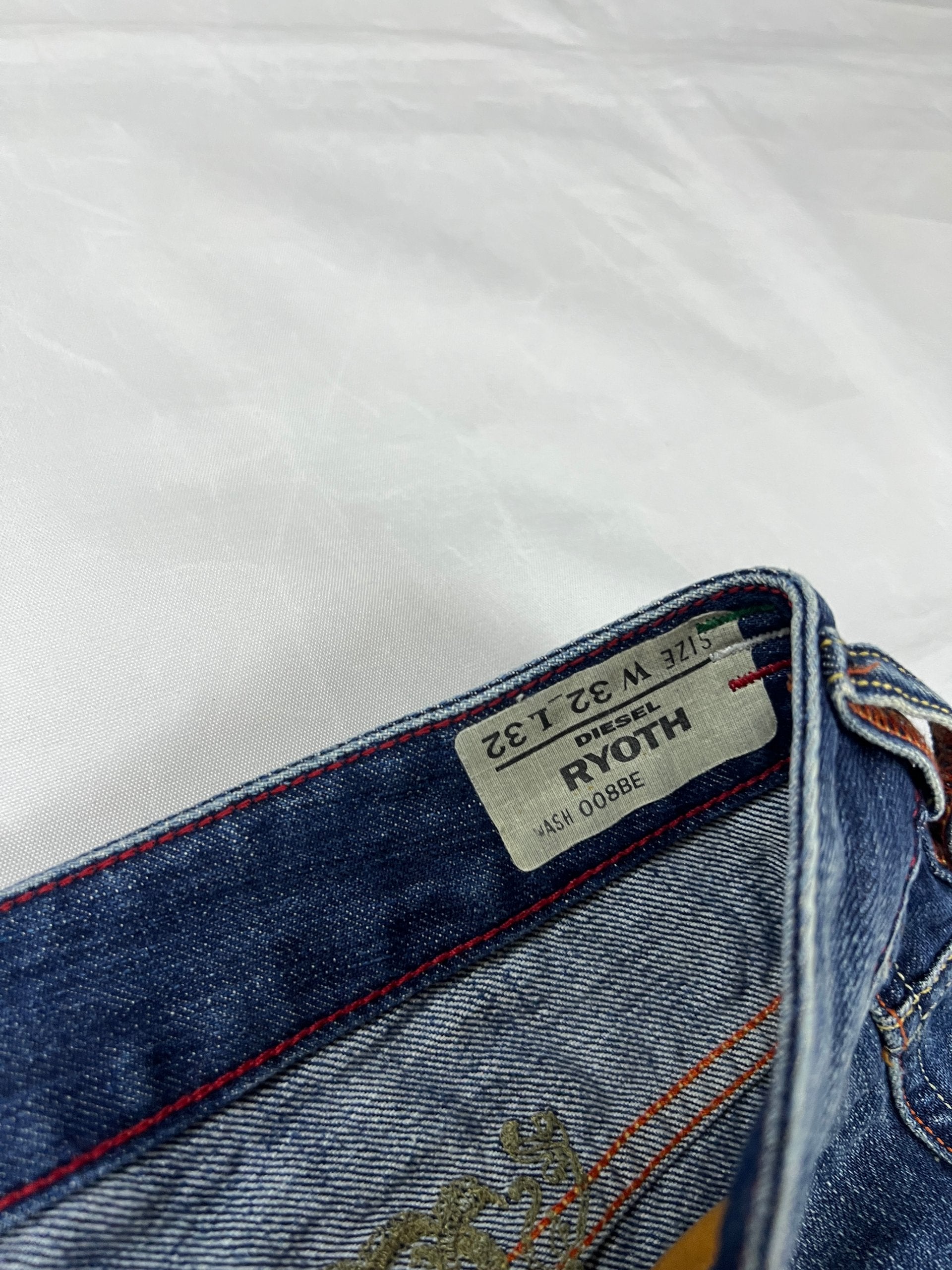 Diesel blue denim jeans W32 L32 with distressed wash and embroidered back pockets.