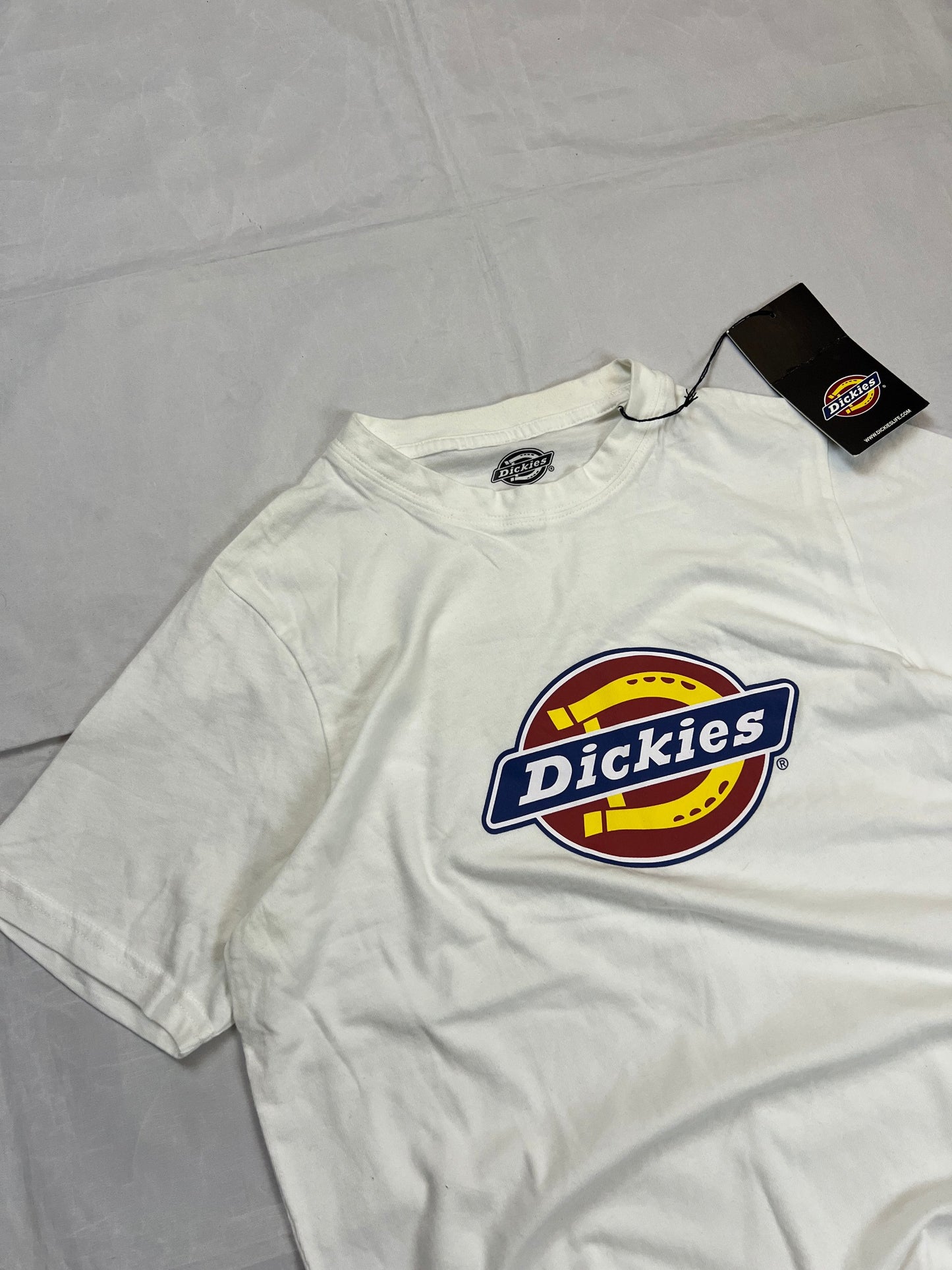 Dickies white t-shirt featuring bold front logo, made from 100% cotton.