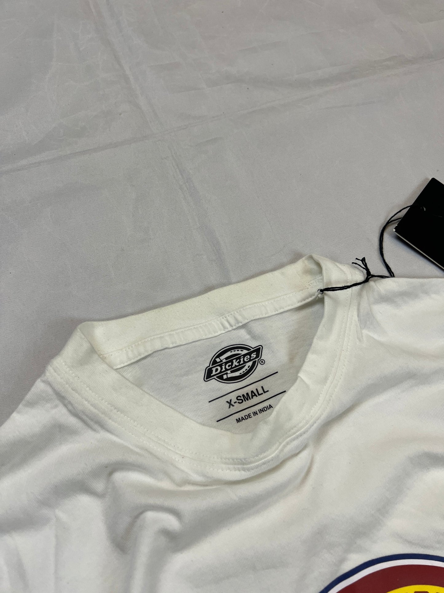 Dickies white t-shirt featuring bold front logo, made from 100% cotton.