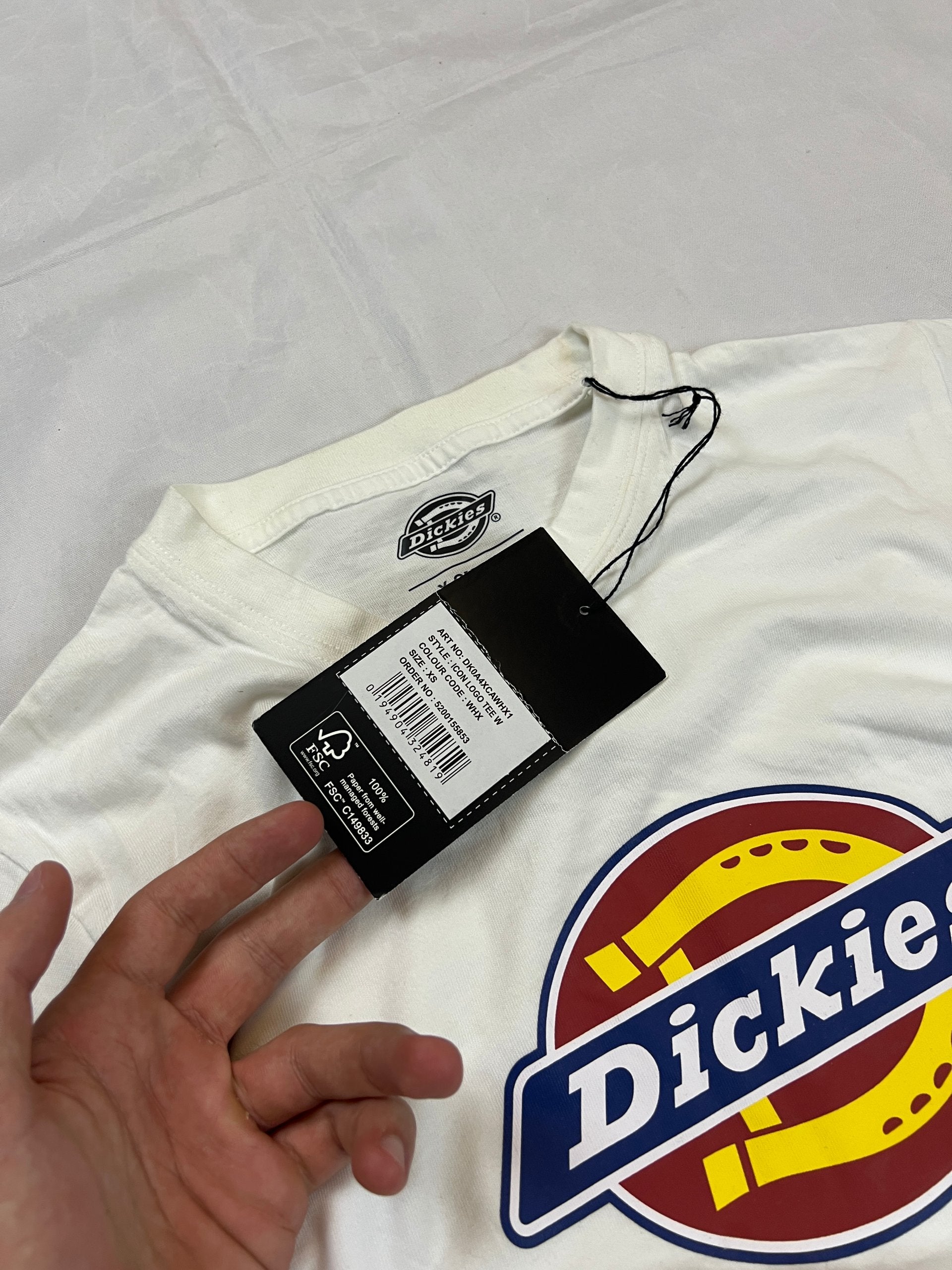 Dickies white t-shirt featuring bold front logo, made from 100% cotton.