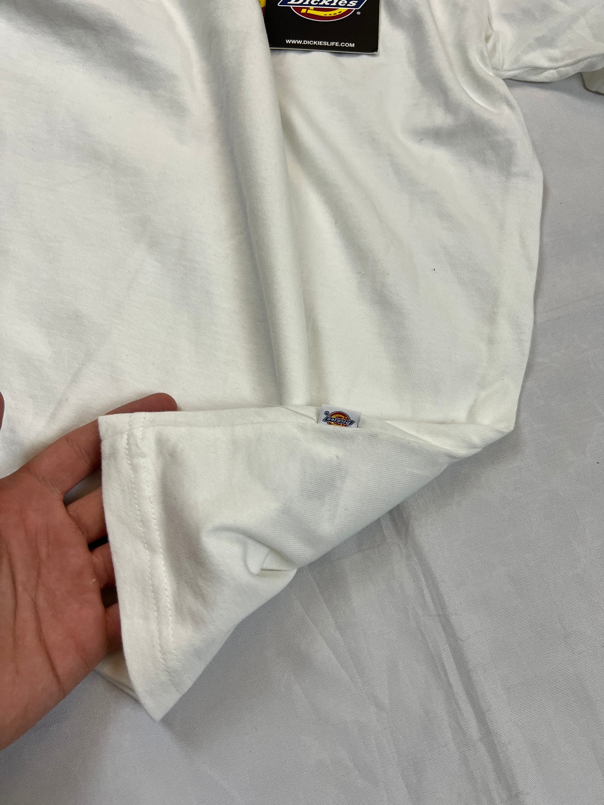 Dickies white t-shirt featuring bold front logo, made from 100% cotton.