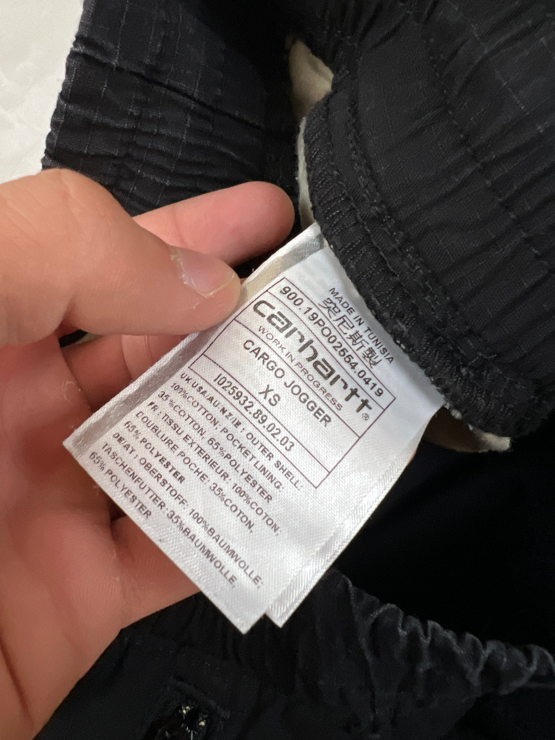 Carhartt black cargo joggers relaxed fit with multiple pockets and elastic cuffs.