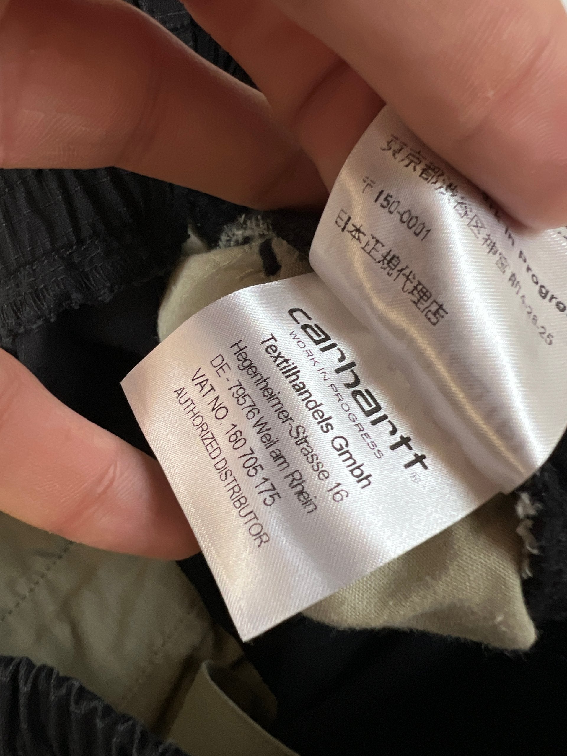 Carhartt black cargo joggers relaxed fit with multiple pockets and elastic cuffs.
