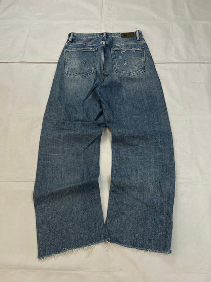 G-Star Raw blue distressed denim jeans with frayed hems and slit detail.