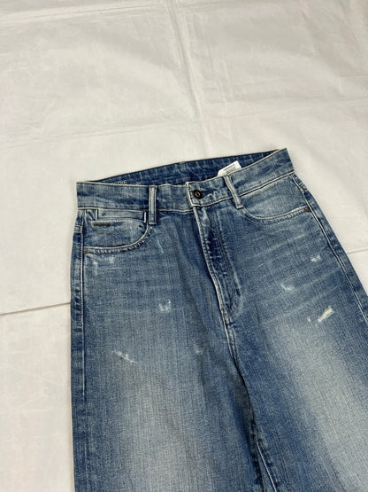 G-Star Raw blue distressed denim jeans with frayed hems and slit detail.