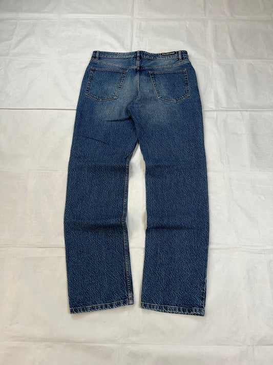 Balenciaga blue denim jeans with five-pocket styling and branded patch at back waist.