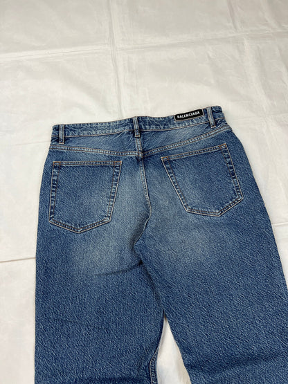 Balenciaga blue denim jeans with five-pocket styling and branded patch at back waist.