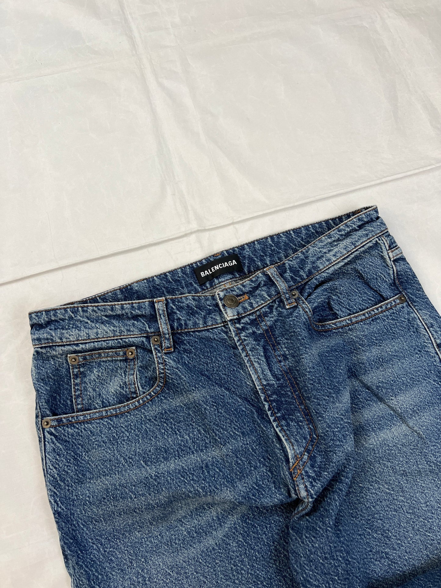 Balenciaga blue denim jeans with five-pocket styling and branded patch at back waist.