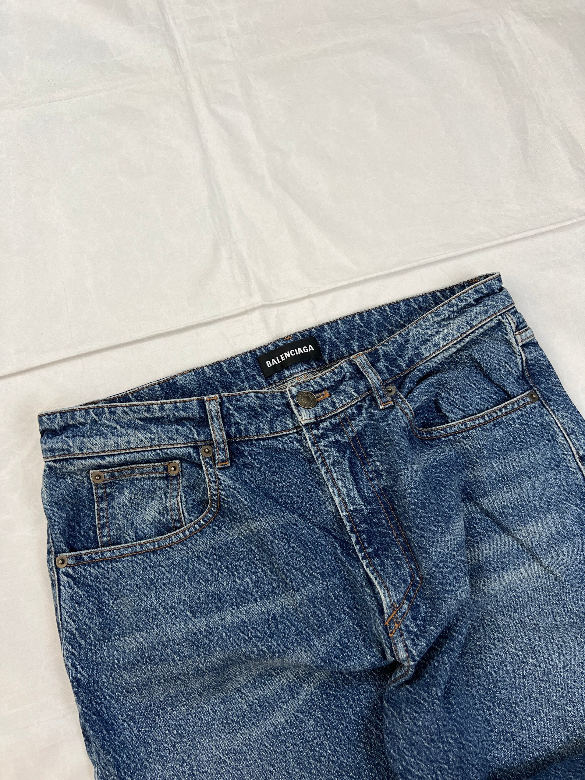 Balenciaga blue denim jeans with five-pocket styling and branded patch at back waist.