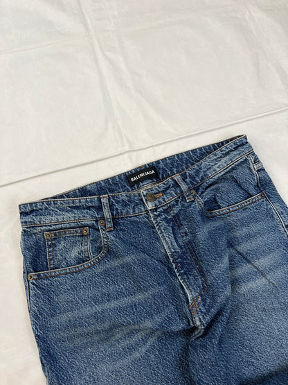 Balenciaga blue denim jeans with five-pocket styling and branded patch at back waist.
