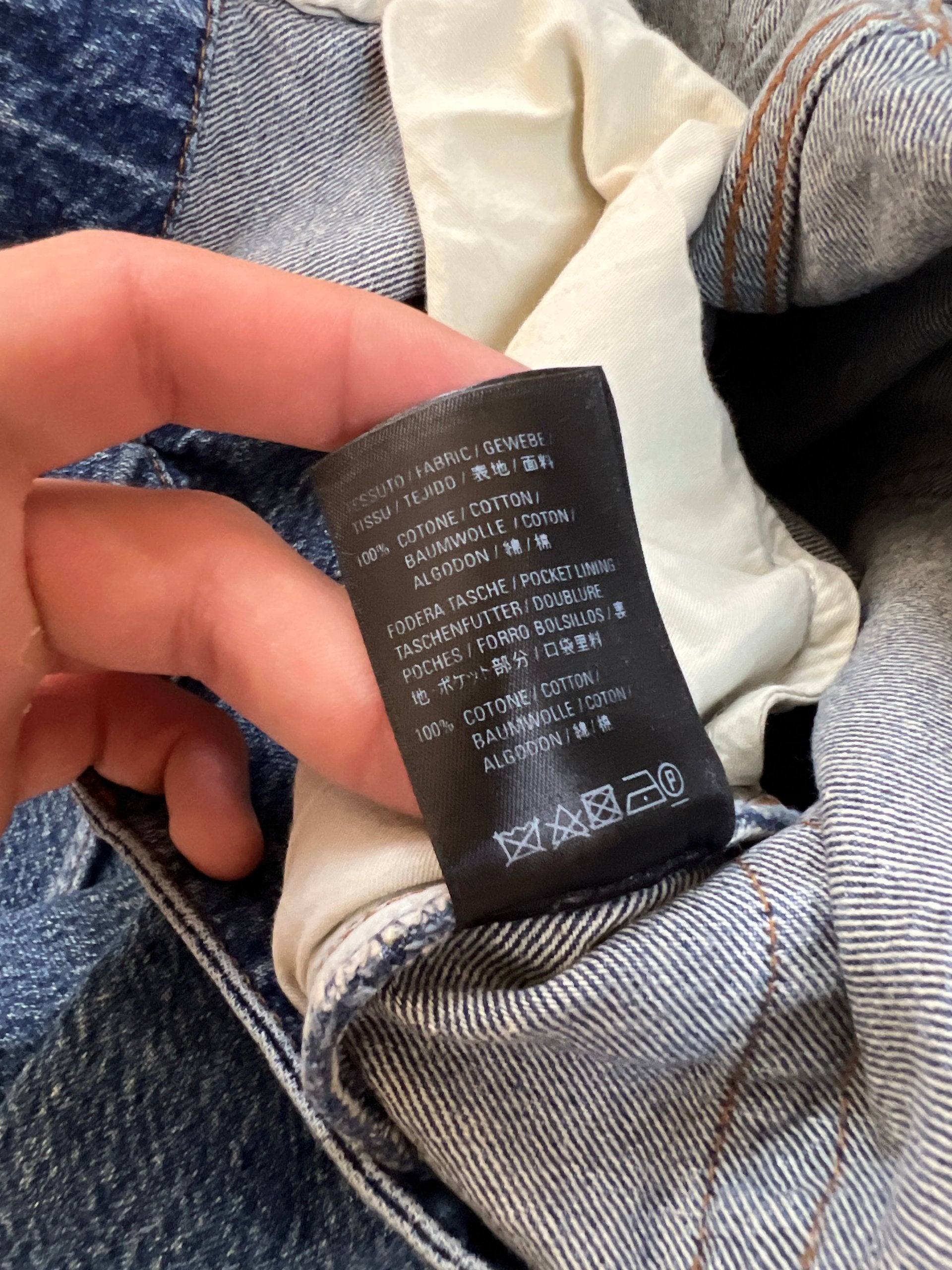 Balenciaga blue denim jeans with five-pocket styling and branded patch at back waist.