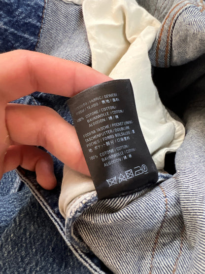 Balenciaga blue denim jeans with five-pocket styling and branded patch at back waist.