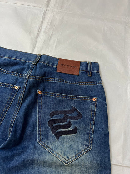 Rocawear blue denim loose fit jeans with faded effect and embroidered back pocket details.