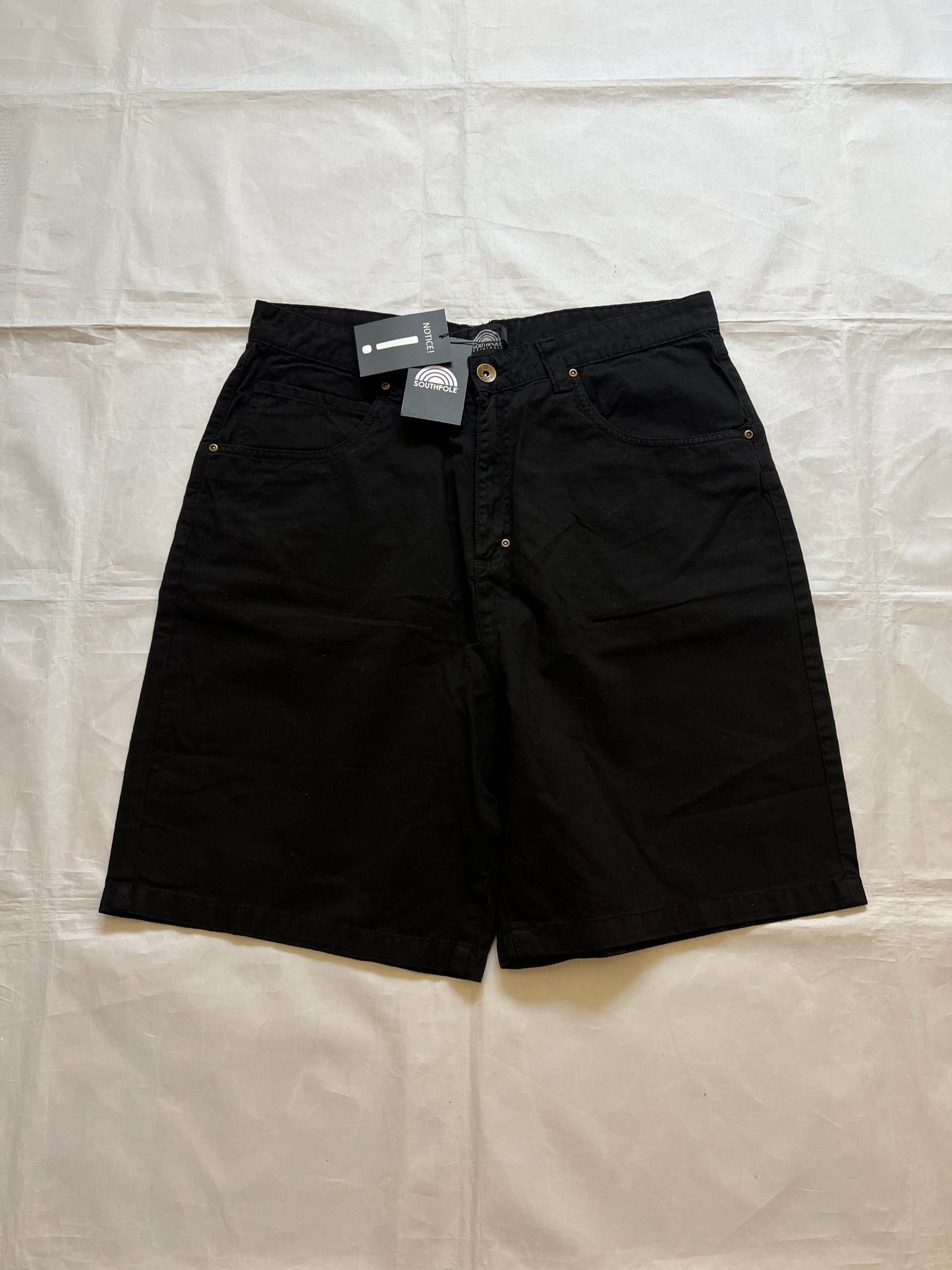 Southpole black denim shorts size 36 with bronze button detailing and embroidered logo.