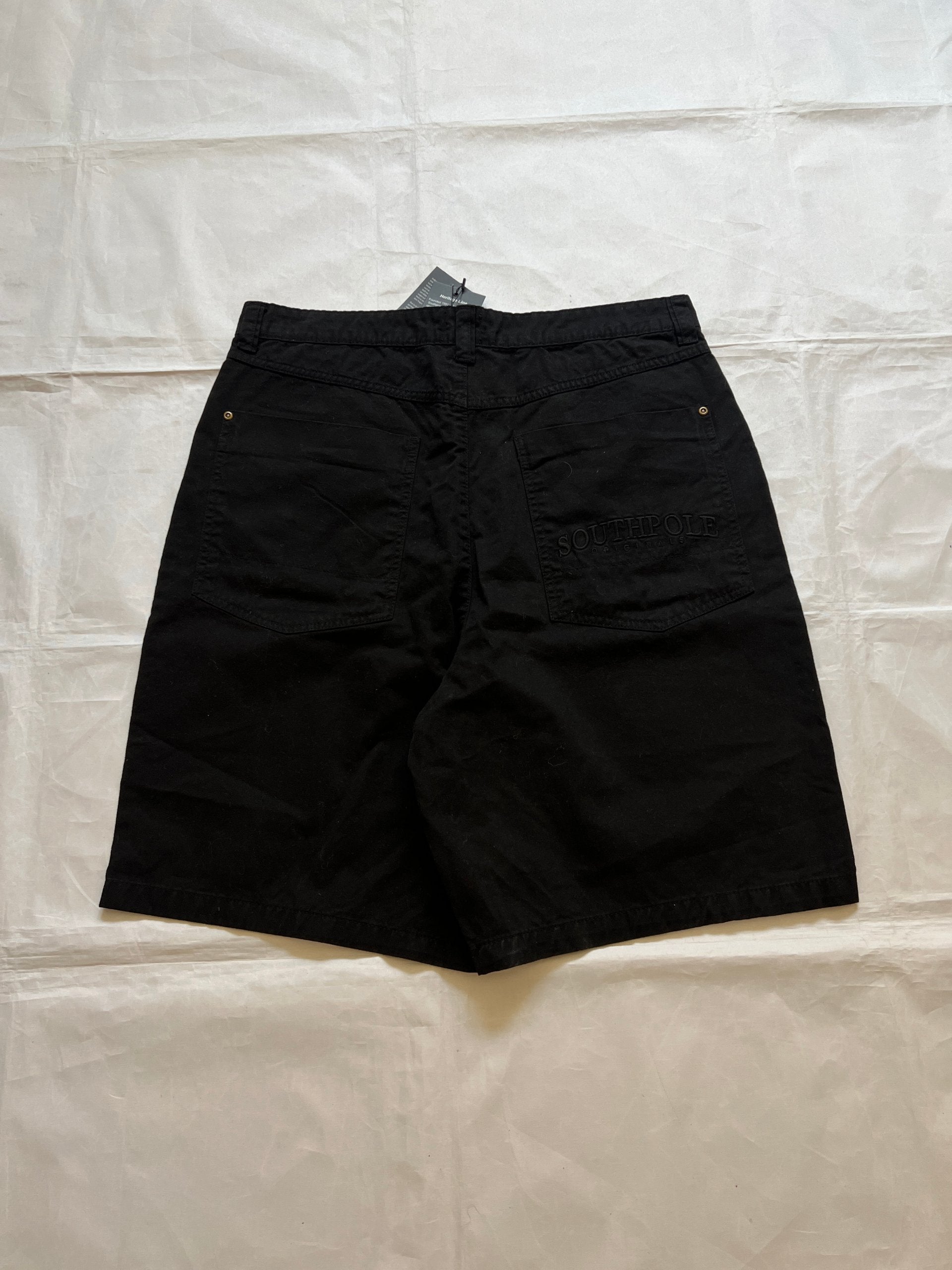 Southpole black denim shorts size 36 with bronze button detailing and embroidered logo.