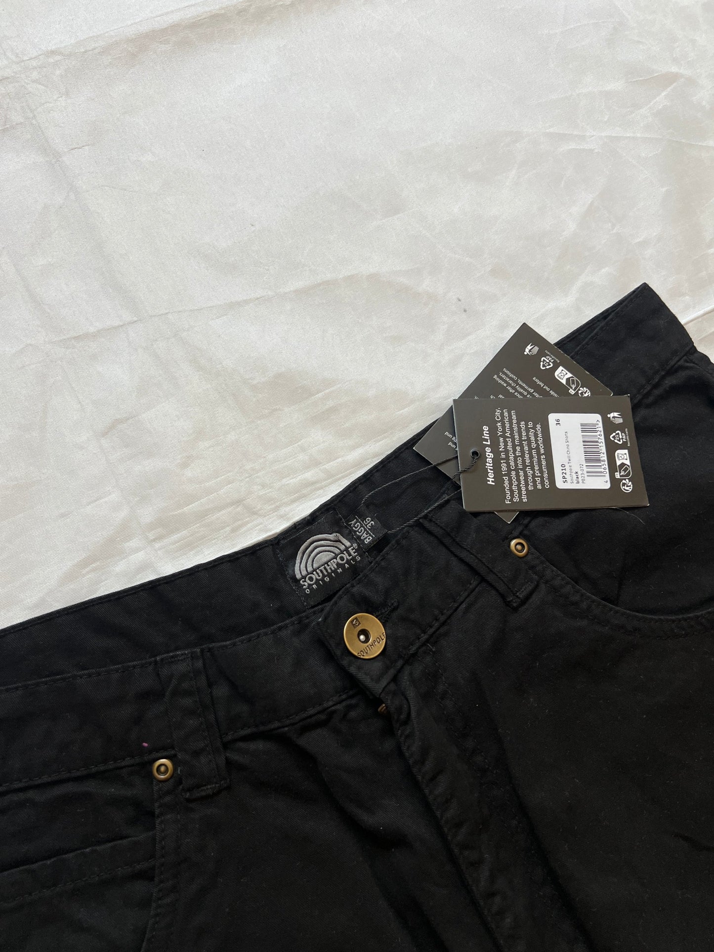Southpole black denim shorts size 36 with bronze button detailing and embroidered logo.