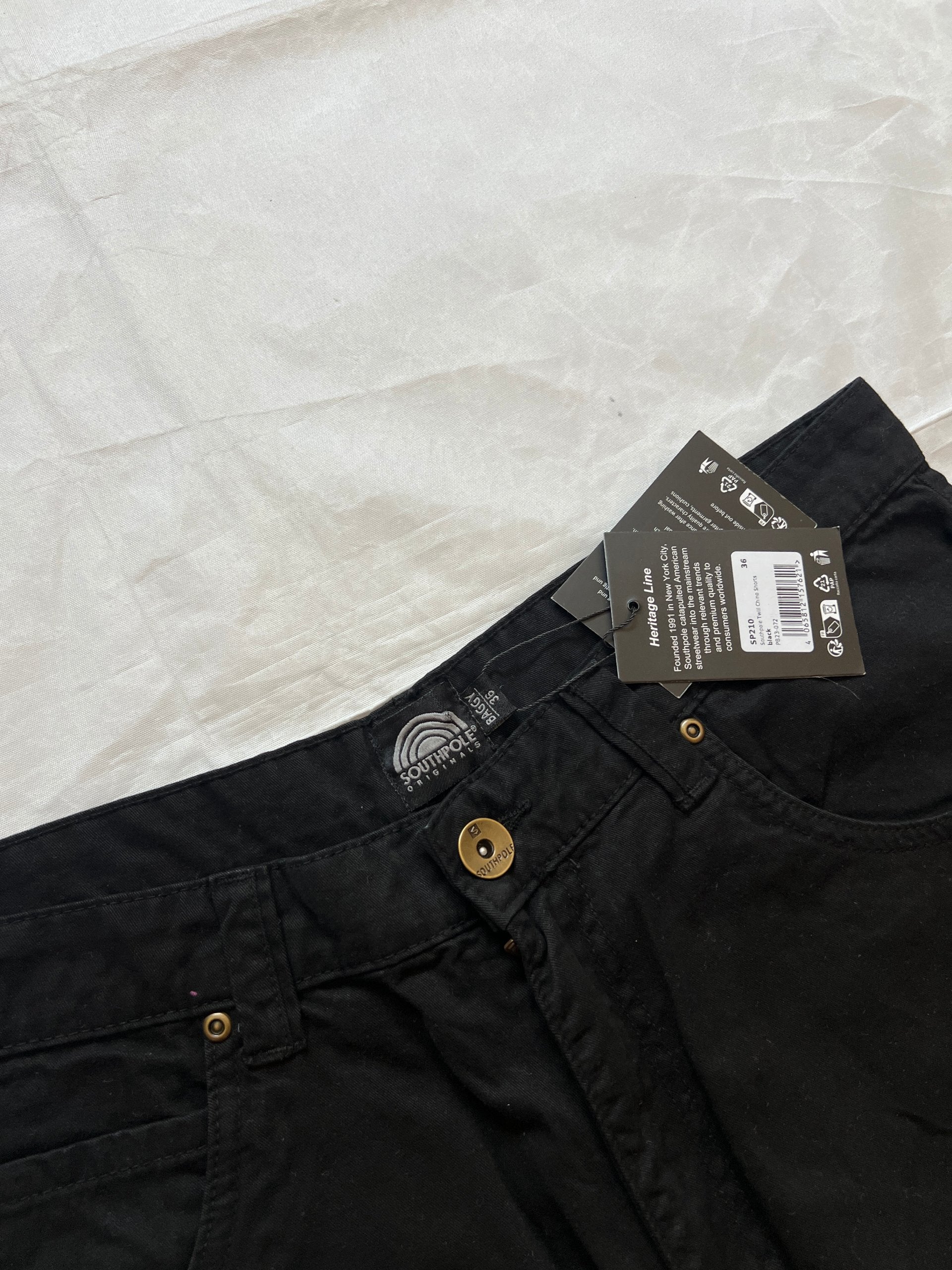 Southpole black denim shorts size 36 with bronze button detailing and embroidered logo.
