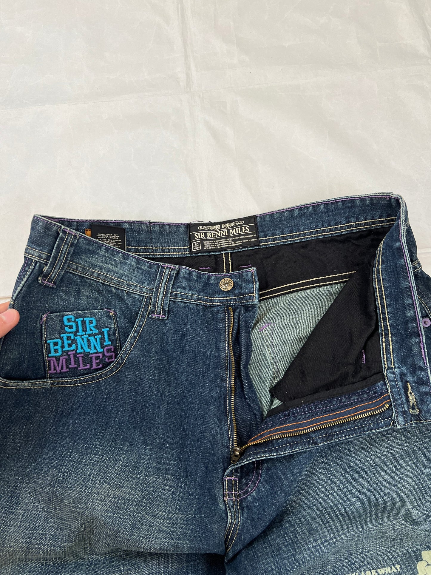SIR BENNI MILES blue denim shorts with embroidered logos and faded wash, 100% cotton.