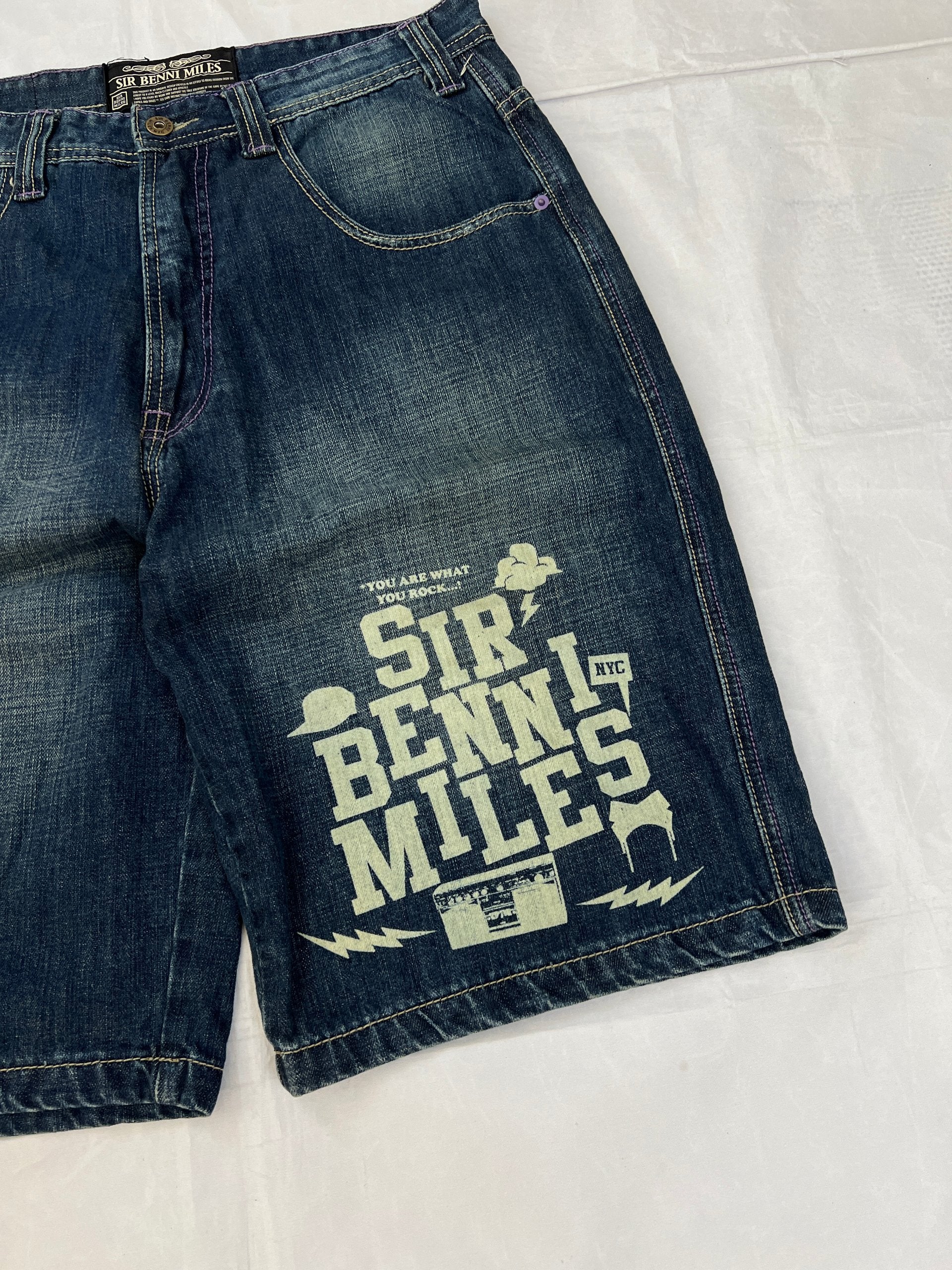SIR BENNI MILES blue denim shorts with embroidered logos and faded wash, 100% cotton.