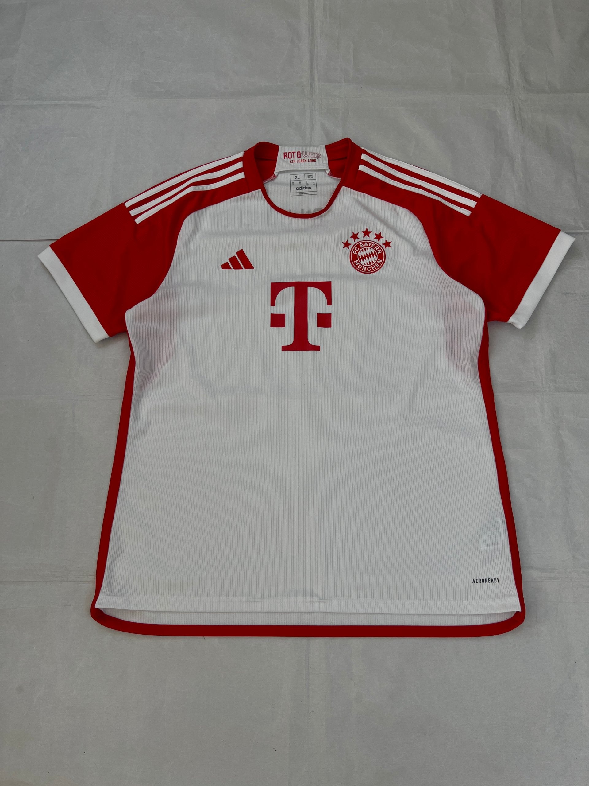 Adidas red and white FC Bayern Munich football jersey, slim fit, AEROREADY technology, 'MIA SAN MIA' detail.