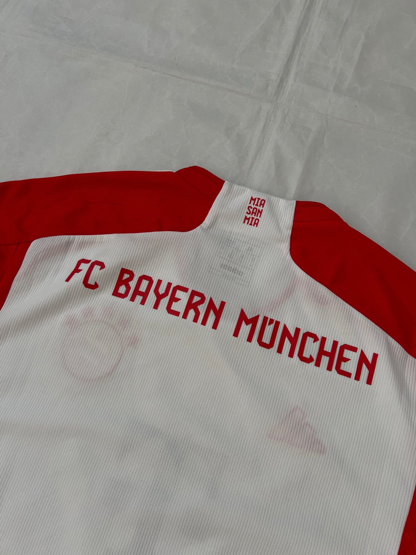 Adidas red and white FC Bayern Munich football jersey, slim fit, AEROREADY technology, 'MIA SAN MIA' detail.
