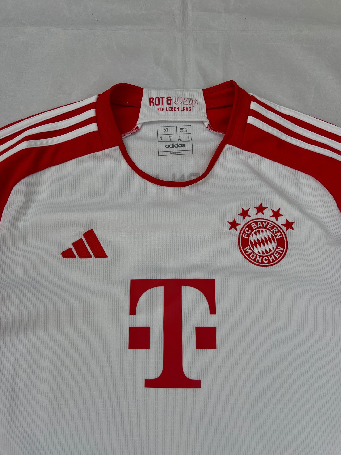 Adidas red and white FC Bayern Munich football jersey, slim fit, AEROREADY technology, 'MIA SAN MIA' detail.