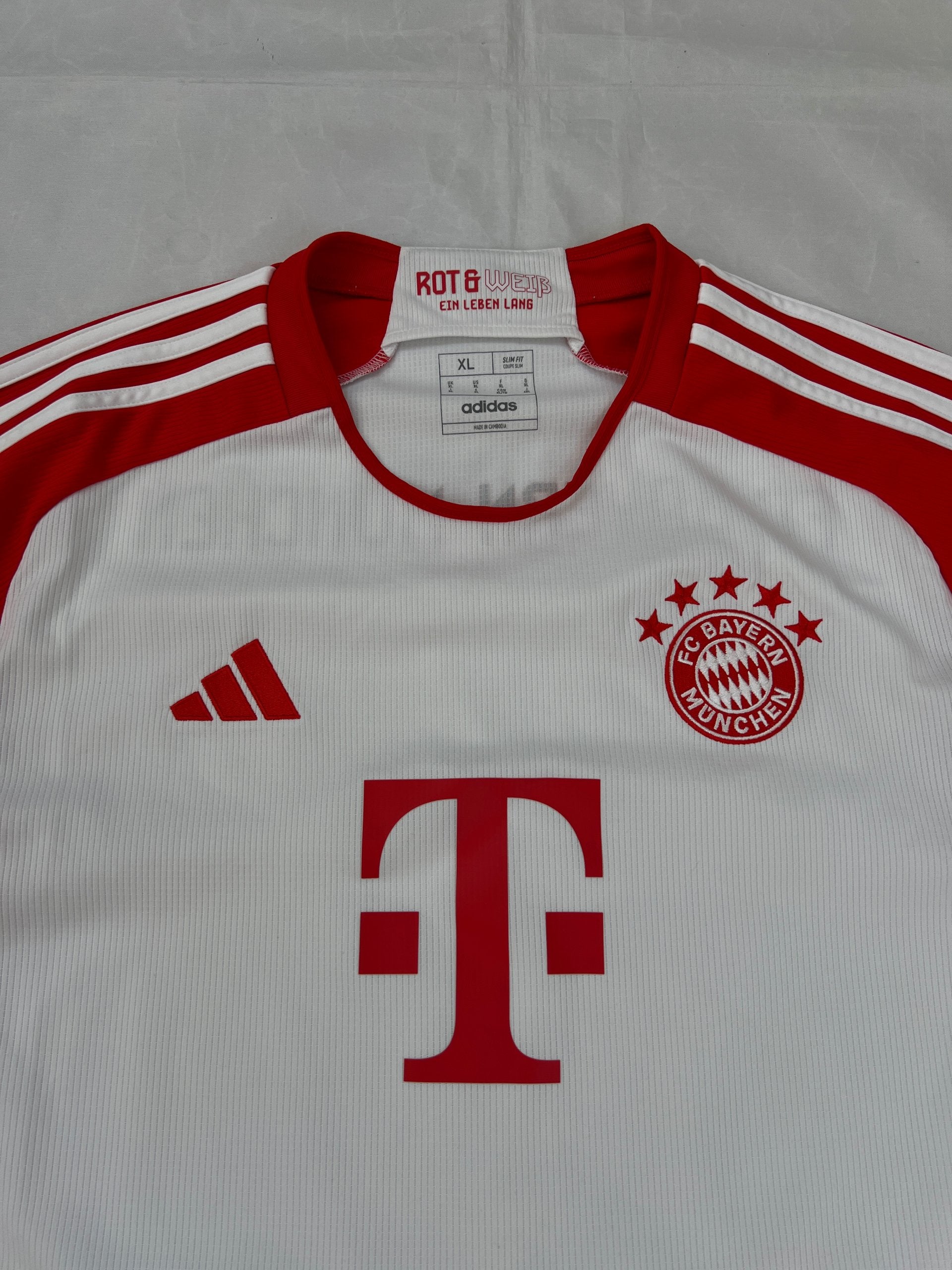 Adidas red and white FC Bayern Munich football jersey, slim fit, AEROREADY technology, 'MIA SAN MIA' detail.
