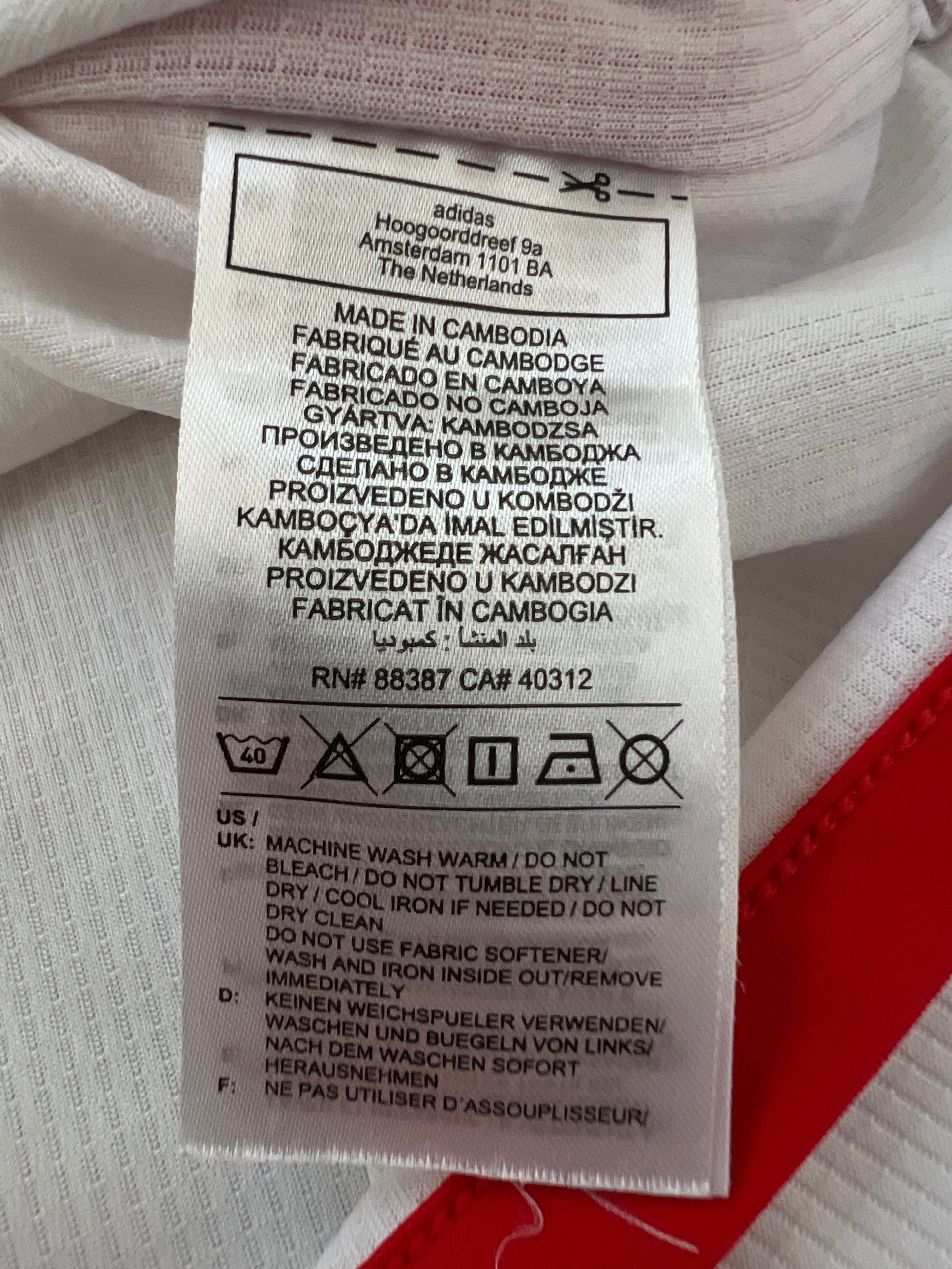Adidas red and white FC Bayern Munich football jersey, slim fit, AEROREADY technology, 'MIA SAN MIA' detail.
