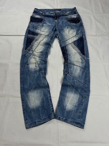 KJM blue denim jeans with white embroidered lion and logo, patchwork stitch detailing.