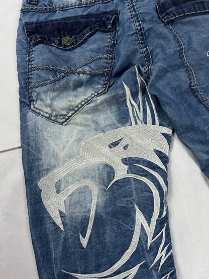 KJM blue denim jeans with white embroidered lion and logo, patchwork stitch detailing.