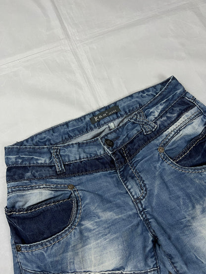 KJM blue denim jeans with white embroidered lion and logo, patchwork stitch detailing.