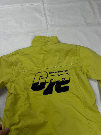 Nike yellow track jacket lightweight nylon with bold embroidered logos and sleeve zipper vent.