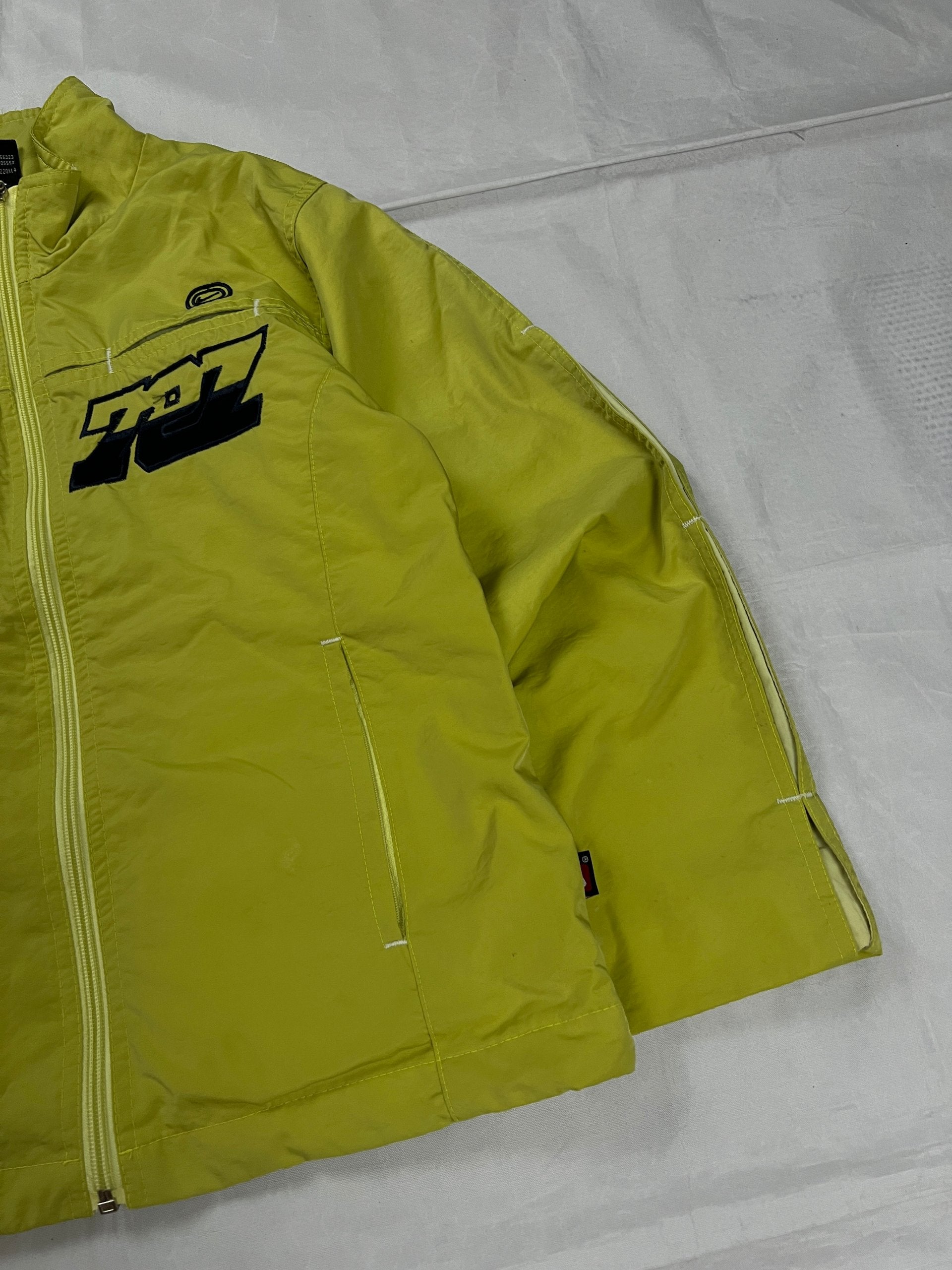Nike yellow track jacket lightweight nylon with bold embroidered logos and sleeve zipper vent.