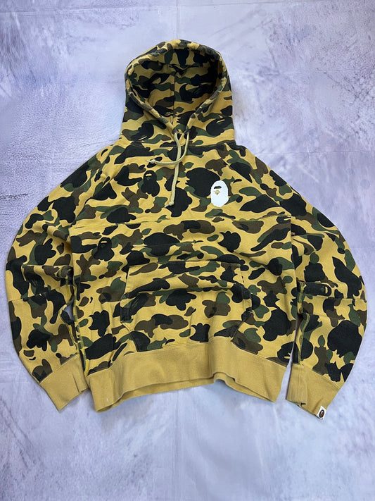 A Bathing Ape black hoodie yellow and green camo pattern with white ape head logo.