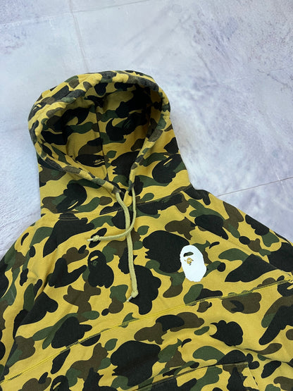A Bathing Ape black hoodie yellow and green camo pattern with white ape head logo.