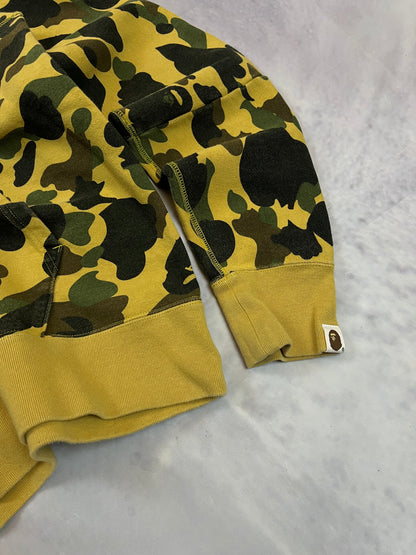 A Bathing Ape black hoodie yellow and green camo pattern with white ape head logo.