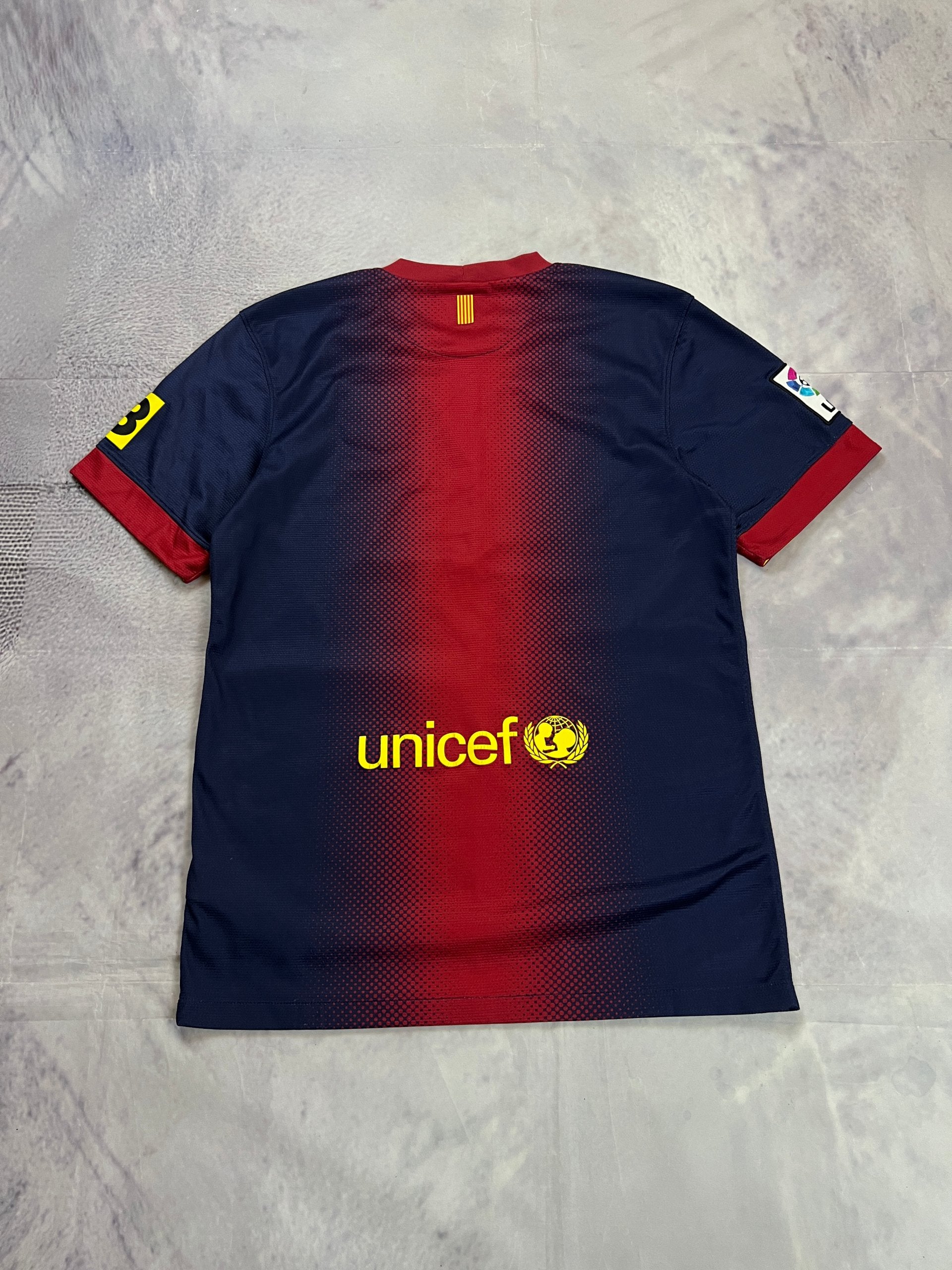 Nike FC Barcelona navy and red football shirt with Qatar Foundation logo and La Liga patches.
