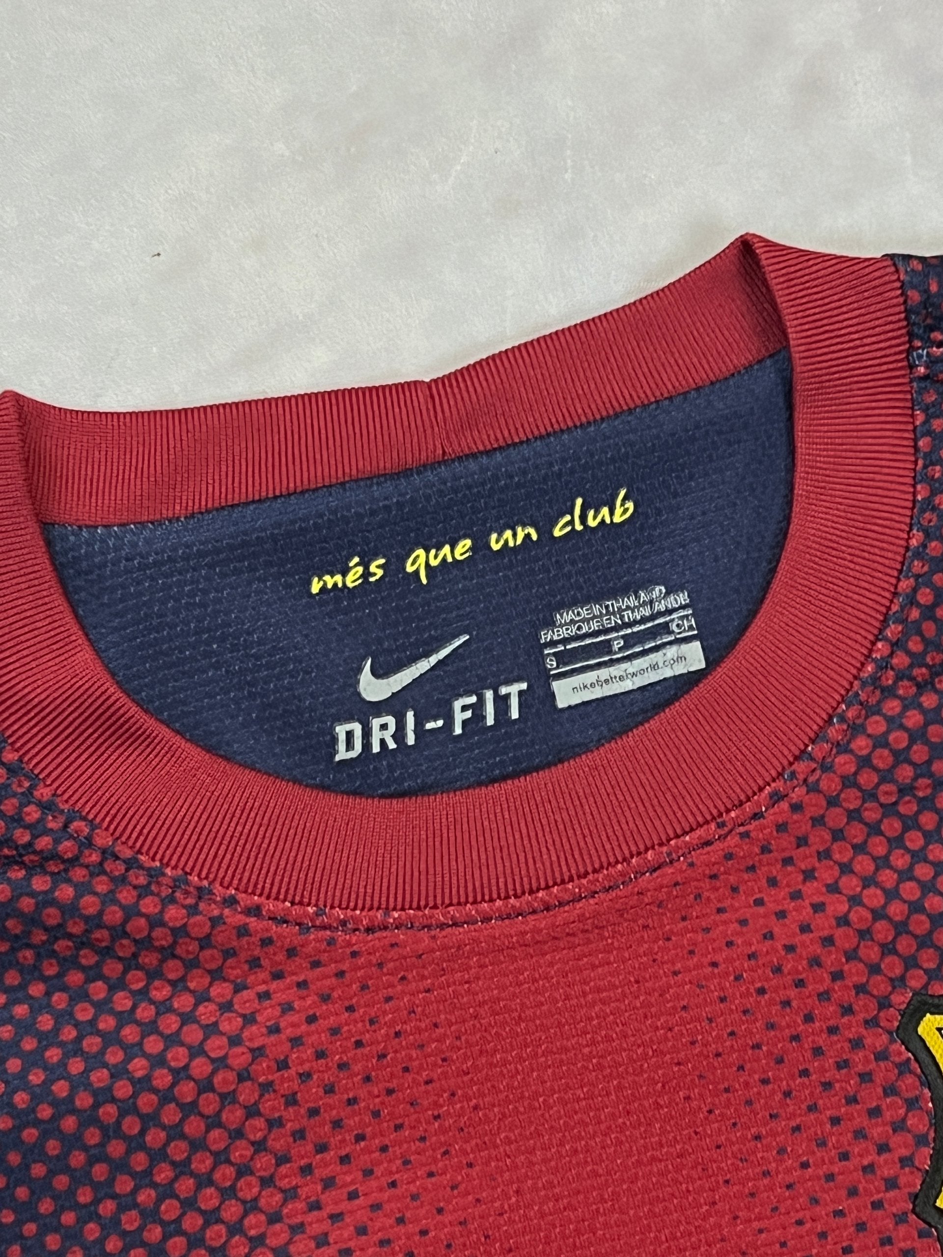Nike FC Barcelona navy and red football shirt with Qatar Foundation logo and La Liga patches.