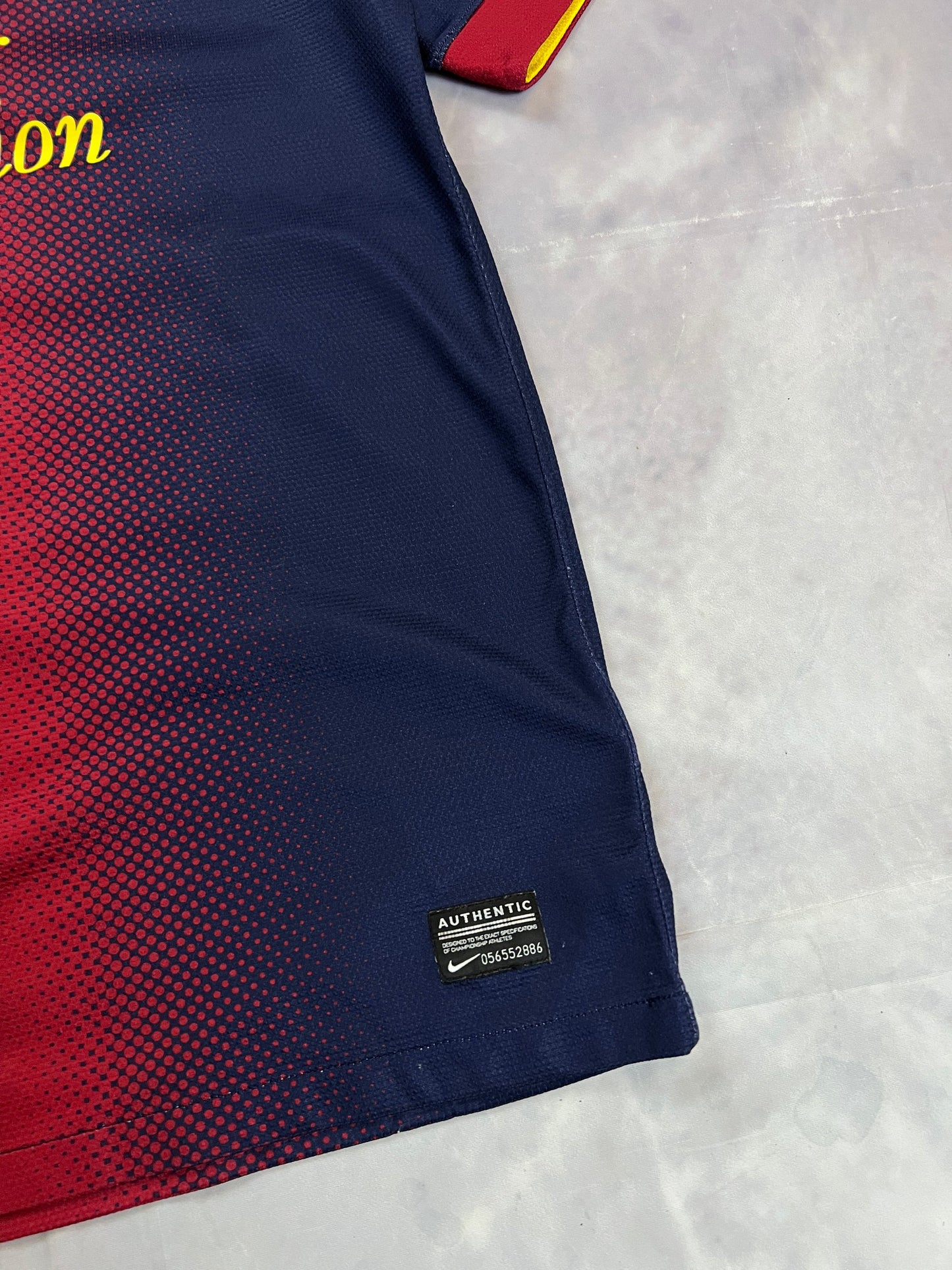 Nike FC Barcelona navy and red football shirt with Qatar Foundation logo and La Liga patches.